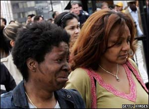 Shocked commuters walk away from the station