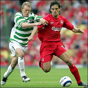 Liverpool striker Fernando Morientes holds off Martyn Naylor