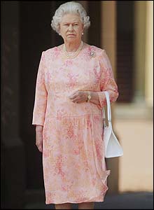 Queen Elizabeth II observes the silence in front of Buckingham Palace