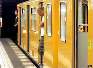 People observe the silence at the Berlin Wittenbergplatz subway station, Germany