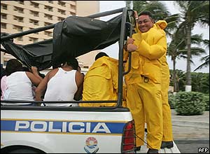 Police move people in Cancun.