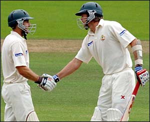 Simon Katich is congratulated by Glenn McGrath after scoring 50