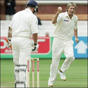 Glenn McGrath celebrates the dismissal of Ashley Giles for a duck to leave England on 158-7