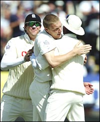 Andrew Flintoff is congratulated by his team-mates