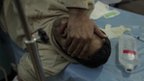 Injured man in Syrian hospital