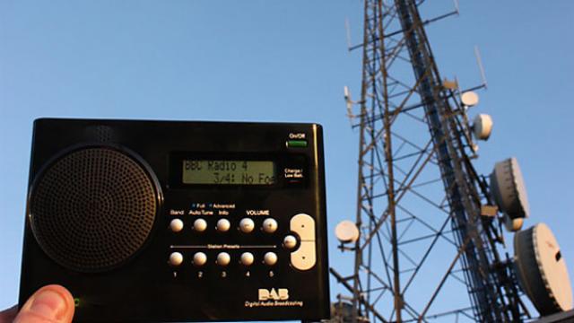 Image of DAB radio being held in front of transmitter