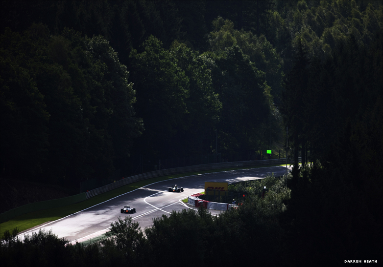 Formula 1 cars enter a corner at the Belgian Grand Prix at Spa