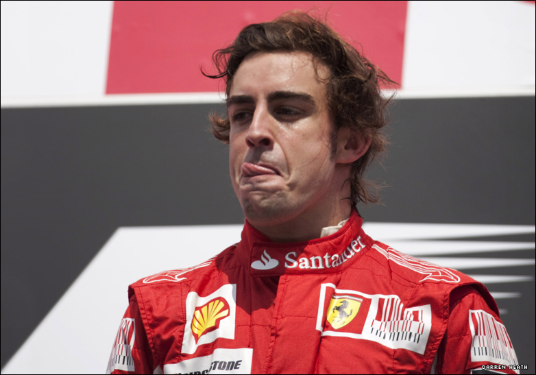 Ferrari's Fernando Alonso on the podium after winning the German Grand Prix