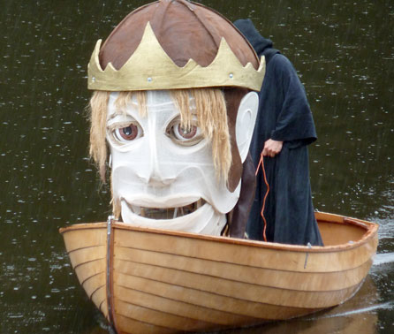 Image of the head of the Bran puppet in a boat. Image courtesy of Small World Theatre