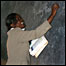 Miss faith writing on the blackboard