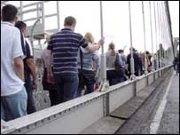 People walking on the Clifton Suspension Bridge