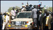 Vice president Salva Kiir (car-C), rides at the back of a car during a rally in Juba, on February 24, 2010