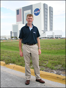 Tim Peake standing outside the VAB
