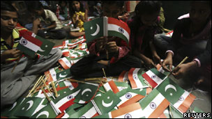 India and Pakistan flags being made to be handed over to cricket fans before the World Cup match between the two countries