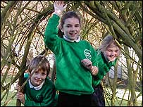 Picture: Pupils in the willow tunnel at Colby Primary School
