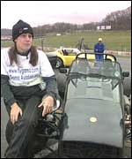 Rachel Green sitting by her car