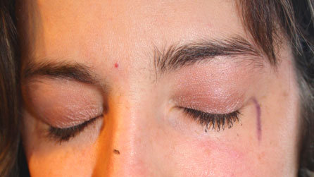 The eyes have it: a close-up of Nicola Dormer's face at the end of the beauty ritual, complete with skewed eyeliner streak and mascara stain on her nose. Oops