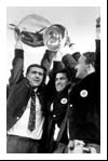 Bobby Murdoch raises the trophy as the players tour Celtic Park