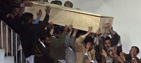 Bhutto's coffin is carried by mourners