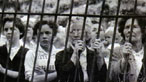 Photograph of women waiting for news after the explosion at Six Bells colliery