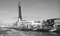 Black and white photograph showing the Blackpool Tower and sea front