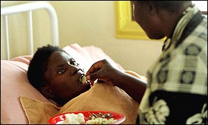 Një grua e sëmurë me AIDS