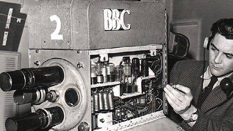 BBC cameraman Bob Unsworth makes an adjustment, 1959 &copy;BBC