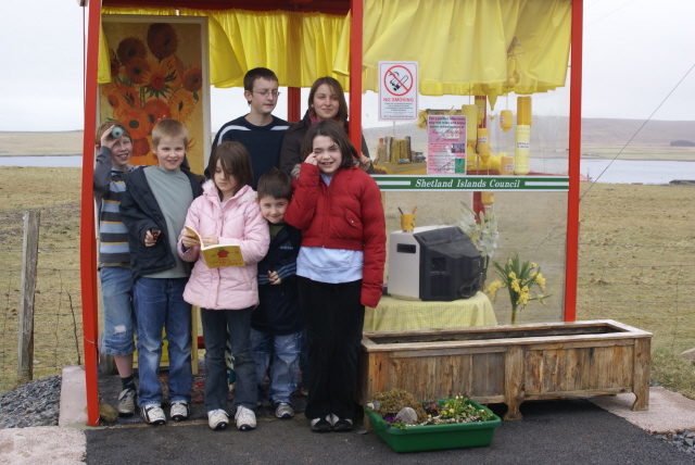 Locals and tourists enjoying Bobbys Bus Shelter together.