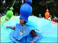 A dancer in a blue flower costume