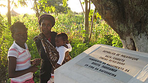 Rosita, with her mother and sister, by the plaque below her birth tree