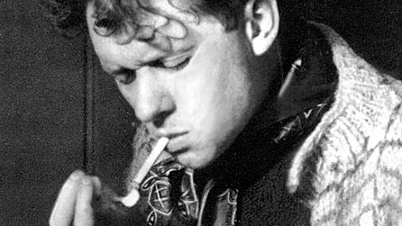Dylan Thomas smoking a cigarette