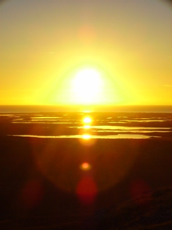 Sunset in the west over Benbecula, from Rueval