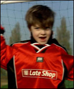 Young boy celebrates.