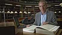 Dr Stephen Baxter studies a replica of the Domesday Book