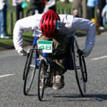 A wheelchair sportsman competing in a road race
