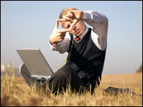 A boy with a laptop computer