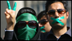 Supporters of opposition leader Mir Hossein Mousavi listen to his speech at a demonstration in Tehran