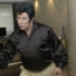 Sir Terry gets into character as Elvis Presley. What use is the sequinned jumpsuit if one has none of the moves?