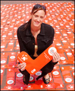 Karen Pickering holding a Sport Relief sock