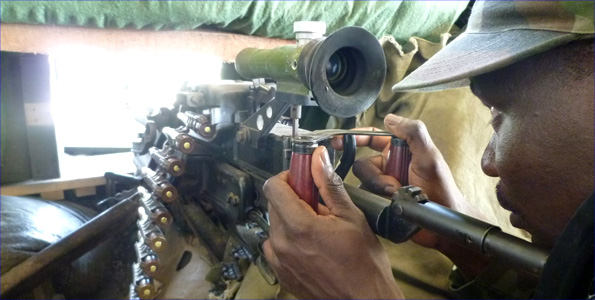 Amisom fighter in Mogadishu looking through the sights of a gun