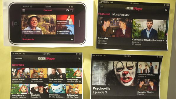 Printouts of mock-ups of different landscape views, stuck to a wall