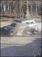 Range Rover driving through water