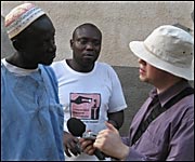 Danny Lawrence interviewing villagers