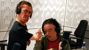 Mat and Liz arm wrestling