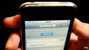 A Twitter page open on a mobile phone browser.