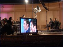 BBC Business Editor, Robert Peston, and Politics Show presenter, Richard Moss, on screen during Politics Show recording at The Sage Gateshead