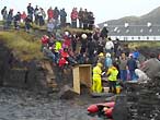 Competitors and spectators at the Stone-skimming championships, Easdale