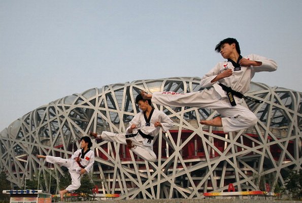 Chinese athletes outside the Beijing Olympic stadium