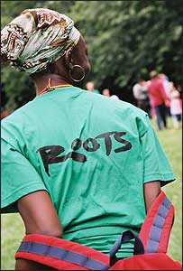 A woman in a ROOTS t-shirt