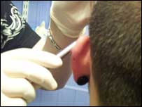 Ear being pierced